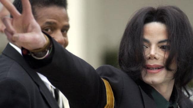 Jackson waved to his supporters at his child molestation trial in 2005. Picture: AP Photo/Michael A. MariantSource:AP