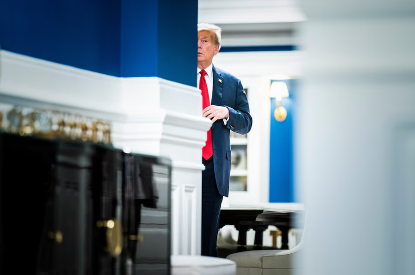 Former president Donald Trump prepares himself before walking out to speak with his attorneys to reporters and members of the media at the Waldorf Astoria hotel in Washington in January. (Jabin Botsford/The Washington Post)