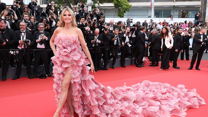 Heidi Klum goes topless in barely there beach snaps with 'no caption needed'