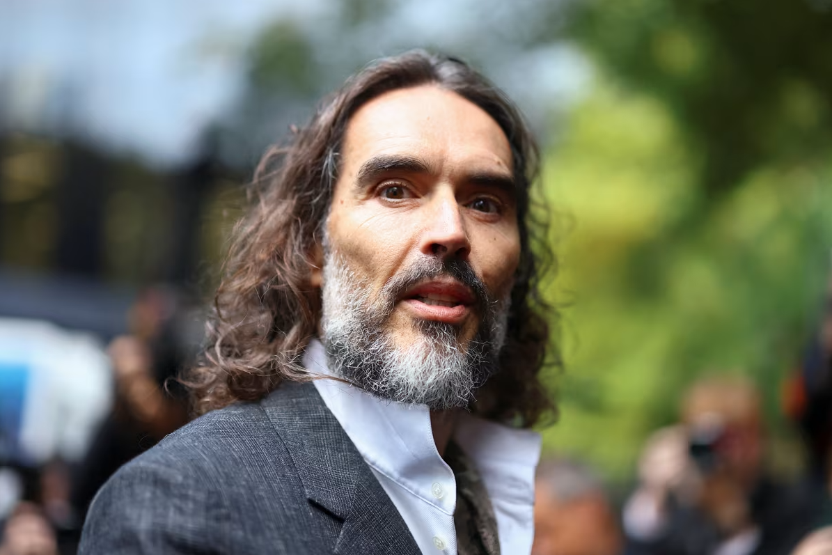 Russell Brand arrives at a court in London on Monday, October 12, 2026 to stand trial on charges of rape and sexual assault relating to six women. Hannah McKay/Reuters