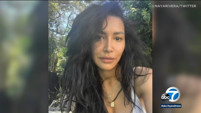 An autopsy report released Friday says "Glee" actor Naya Rivera raised her arm and called for help as she accidentally drowned while boating with her 4-year-old son on a California lake.
