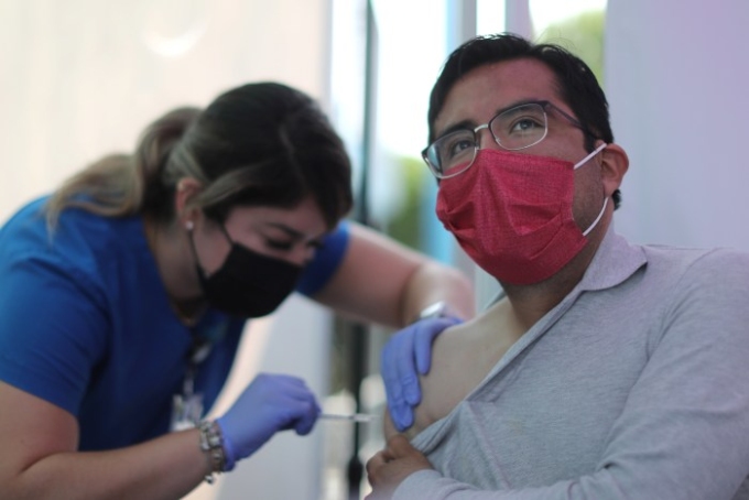 Preliminary research suggests that the protection provided by Covid-19 vaccines wanes over time. Lucy Nicholson/Reuters