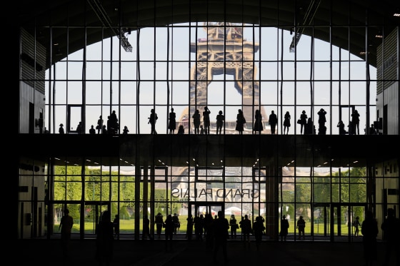 visitors gather during a presentation visit of the exhibition hall "Grand Palais Ephemere" in Paris on June 9, 2021.Francois Mori / AP file