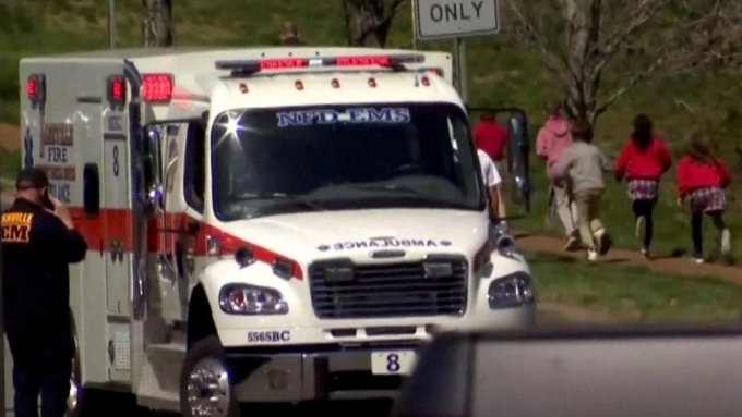 NEWSNATION/REUTERS An ambulance stands near Nashville's Covenant School as children are escorted away
