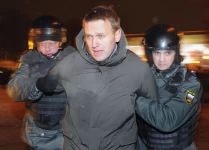 Alexander Nemenov/AFP/Getty Images. Navalny, pictured being detained at a protest in Moscow in 2012, has been a thorn in Putin's side for more than a decade.