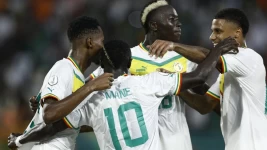 Habib Diallo (left) celebrates after scoring Senegal's second goal against Cameroon at the Africa Cup of Nations on January 19, 2024. © Kenzo Tribouillard, AFP