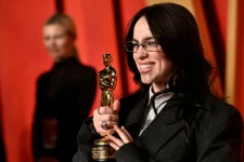 Billie Eilish, arriving at the Vanity Fair Oscars party on Sunday night, became the youngest two-time Oscar winner with her award for “What Was I Made For?” (Evan Agostini/Evan Agostini/Invision/AP)