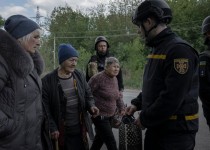 Evacuees from the Ukrainian village of Lyptsi, near the Russian border, being taken to the city of Kharkiv on Sunday.Credit...Emile Ducke for The New York Times