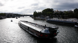 A flotilla of boats cruises on the Seine river during a test for the Paris 2024 Olympic Games opening ceremony in Paris, France on June 17, 2024. © Benoit Tessier, Reuters