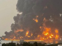 A huge column of fire erupts from Yemen’s Hodeida port. Picture: Ansarullah Media Center/AFP