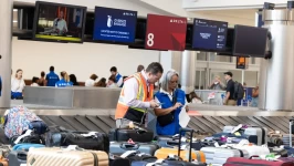 Delta Air Lines employees try to locate passengers' luggage after cancelled and delayed flights at Hartsfield-Jackson Atlanta International Airport on Monday. Jessica McGowan/Getty Images