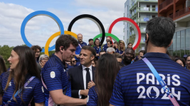 French President Emmanuel Macron meets athletes at the Olympic Village, July 22, 2024. © Michel Euler, AP