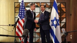 U.S. Secretary of State Antony Blinken, left, meets with Israel's President Isaac Herzog in Tel Aviv on Monday. (Kevin Mohatt/AFP/Getty Images)