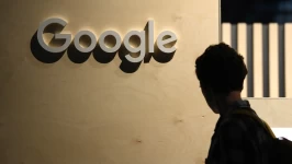 A woman passes the logo from the web search engine provider Google during the digital society festival 're:publica,' at the Arena Berlin in Berlin, Germany June 9, 2022. Annegret Hilse/Reuters