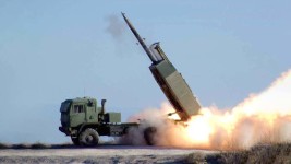 FILE PHOTO: The High Mobility Artillery Rocket System fires the Army's new guided Multiple Launch Rocket System during testing at White Sands Missile Range. ©  Wikipedia