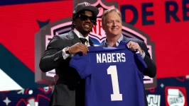 Nabers poses with NFL Commissioner Roger Goodell after being selected sixth overall by the New York Giants. Gregory Shamus/Getty Images