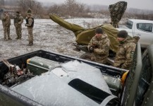 Ukrainian servicemen from air defence units prepare for an award ceremony after repelling the second biggest Russian missile and drone attack in five days, near Kyiv