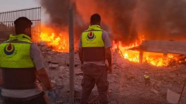 Rescuers rush to the scene of an Israeli strike. Picture: Kawnat Haju/AFP