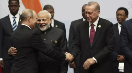 In this file photo, Turkish President Recep Tayyip Erdogan greeting Russian President Vladimir Putin as Indian PM Narendra Modi looks on taken at a BRICS meeting in South Africa on July 27, 2018. © AP