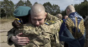 Ukrainians are greeted after being released in a prisoner exchange at an undisclosed location in Ukraine, September 13, 2024. © Ukrainian Presidential Press Office via AP