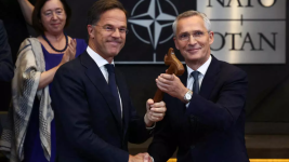 Jens Stoltenberg (right) hands over NATO leadership to the military alliance's new Secretary-General Mark Rutte in Brussels, Belgium, October 1, 2024. © Yves Herman, Reuters