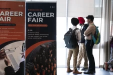 Attendees wait for a career fair to begin in Burnaby, British Columbia, on June 24.Photographer: Paige Taylor White/Bloomberg