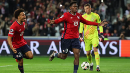 Lille's Jonathan David celebrates scoring from the penalty spot in the Champions League match against Real Madrid at the Pierre Mauroy Stadium in Villeneuve-d'Ascq, northern France, on October 2, 2024. © Franck Fife, AFP