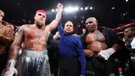 Paul getting his hand raised after beating the 58-year-old. (Photo by Al Bello/Getty Images for Netflix)