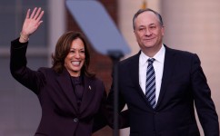 U.S. Vice President Kamala Harris waves next to her husband Doug Emhoff after she delivered remarks, conceding the 2024 U.S. presidential election to President-elect Donald Trump, at Howard University in Washington, D.C. on November 6, 2024. Hannah McKay