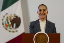 Lead Art: Mexican President Claudia Sheinbaum briefs the media in Mexico City, Oct. 2, 2024, the morning after her inauguration. | Fernando Llano/AP