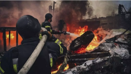 Rescue workers put out a fire following a Russian strike in Brovary outside Kyiv in this photo provided by the Ukrainian Emergency Service on November 13 2024. © APUkrainian Emergency Service via AP