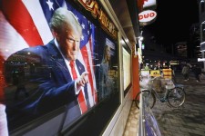 President-elect Donald Trump is seen on a screen during a news program, in Tokyo, Japan, on Nov. 6, 2024. AP