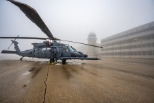 A US military helicopter sits in the dense fog at Wright-Patterson Air Force Base in November 2024. US Air Force photo by Daniel Peterson