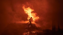 Ukrainian first responders work at the site of a Russian missile assault on the city center of Kyiv, Ukraine, on December 20, 2024. Vlada Liberova/Libkos/Getty Images