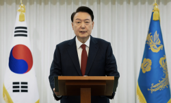 View image in fullscreen Impeached South Korean President Yoon Suk Yeol speaks at the presidential residence in Seoul. A South Korean court has approved an arrest warrant for Yoon. Photograph: AP