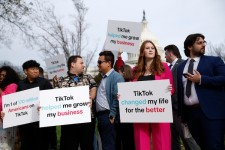 Participants hold signs in support of TikTok outside the Capitol Building, March 13, 2024, in Washington, D.C. Anna Moneymaker/Getty Images