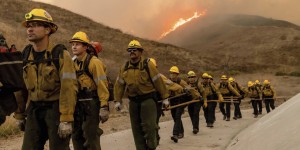 Fire crews battled the newly ignited Kenneth fire in the West Hills section of Los Angeles on Thursday. ETHAN SWOPE/ASSOCIATED PRESS