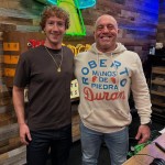 Mark Zuckerberg and Joe Rogan pose for a photograph before recording.