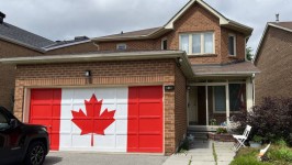 A Canadian flag painted on a garage the day before Canada Day celebrations in Toronto on June 30, 2024. ©  Creative Touch Imaging Ltd. / NurPhoto / Getty Images