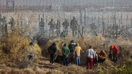 Migrants near the Rio Grande along the US-Mexico border in Juarez, Chihuahua state, Mexico, on December 18, 2024.  David Peinado/Bloomberg/Getty Images