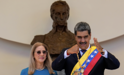 Nicolás Maduro gestures next to his wife, Cilia Flores, after his swearing-in ceremony for a third term in Caracas, Venezuela, on 10 January. Photograph: Ariana Cubillos/AP