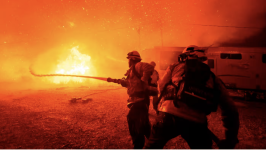 Firefighters battle the Hughes fire near Santa Clarita, California, on Wednesday © Ethan Swope/AP