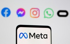 Facebook's new rebrand logo Meta is seen on smartpone in front of displayed logo of Facebook, Messenger, Intagram, Whatsapp, Oculus in this illustration picture taken October 28, 2021. REUTERS/Dado Ruvic/Illustration/File Photo