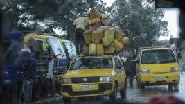 A man stacks jerry cans on top of a vehicle in Bukavu on Friday as M23 rebels backed by Rwanda advanced on the city in eastern Congo. (Amani Alimasi/AFP/Getty Images)