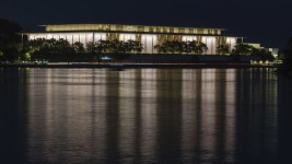 The John F. Kennedy Center for the Performing Arts is reflected in the Potomac River in Washington, September 24, 2022.  J. David Ake/AP