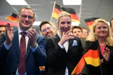 AfD co-leaders Alice Weidel and Tino Chrupalla cheer with party members on election night in Berlin on Sunday. Soeren Stache/Pool/AFP/Getty Images