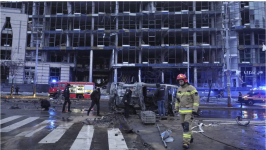 First responders work the scene following a Russian missile attack in Kyiv, Ukraine, Saturday, January 18, 2025. © Efrem Lukatsky, AP