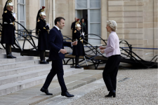 French President Emmanuel Macron welcomes European Commission President Ursula von der Leyen as she arrives for a meeting with European leaders on Ukraine and European security at the Élysée Palace in Paris on Monday. (Abdul Saboor/Reuters)