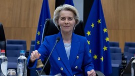 European Commission President Ursula von der Leyen rings a bell to signify the beginning of the weekly college of commissioners meeting at EU headquarters in Brussels, on Wednesday. (Omar Havana/The Associated Press)