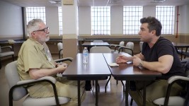 Collier Landry, talks to his his father, John Francis Boyle Jr., at the Marion Correctional Institution in Marion, Ohio, where Boyle is an inmate.  Courtesy Collier Landry
